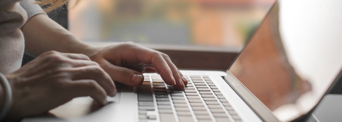 laptop person working on a laptop
